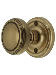 Classic Rosette Door Set with Norwich Knobs in Antique Brass.